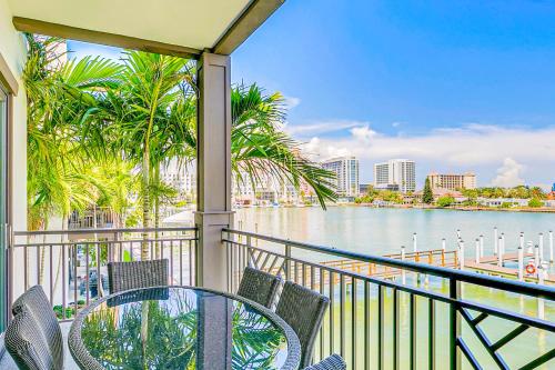 a balcony with a table and chairs and the water at BrightWater Blue 158-2 in Clearwater Beach