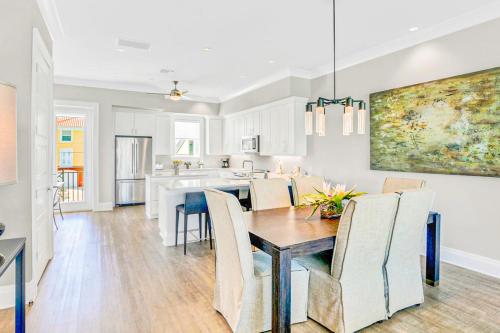 a kitchen and dining room with a table and chairs at BrightWater Blue 158-2 in Clearwater Beach
