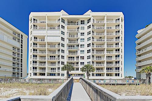 a view of two tall buildings from the beach at SeaSpray East E0122 in Perdido Key