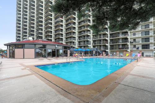 a swimming pool in front of a large apartment building at Sea Watch II in Ocean City