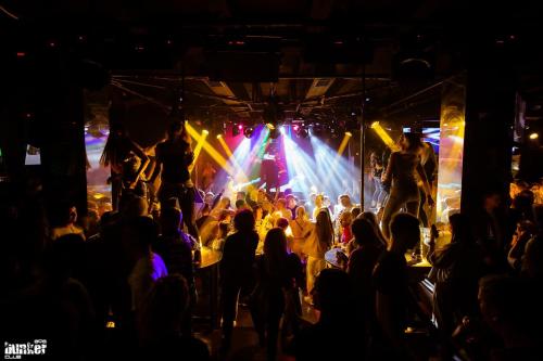 a crowd of people watching a band on a stage at Ays Club Sheregesh in Sheregesh