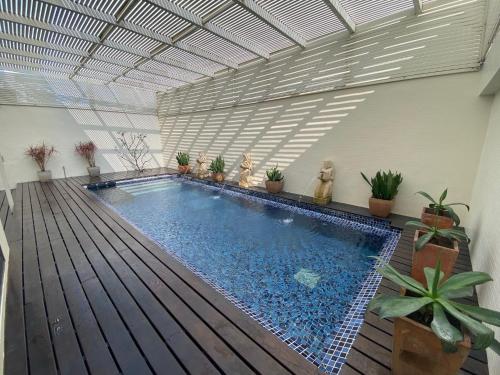 a large swimming pool in a room with a ceiling at Xiadu Motel in Taichung