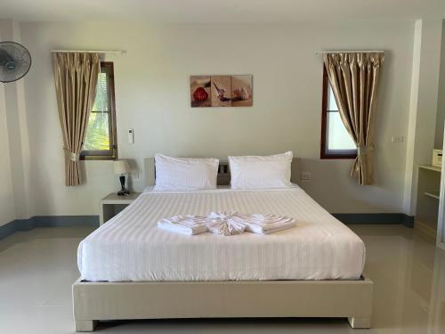 Ένα ή περισσότερα κρεβάτια σε δωμάτιο στο Breeze Bay Villa