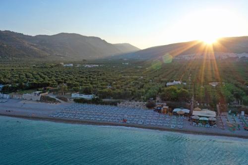 an aerial view of a resort next to the water at Ferienwohnung ulivo mit Pool und Privatstrand in Mattinata