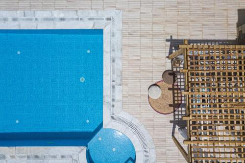 an overhead view of a swimming pool in a building at Agapi Villas I & II, fairytale seaside retreats, By ThinkVilla in Panormos Rethymno