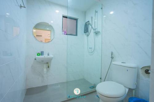 a bathroom with a shower and a toilet and a sink at Doorstep - Sunway Putra Mall - Close to PWTC for 4 in Kuala Lumpur