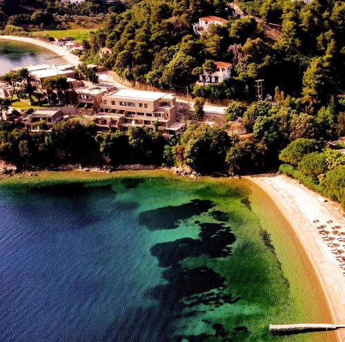 an aerial view of a beach with turquoise water at Cape Kanapitsa Hotel & Suites in Kanapitsa