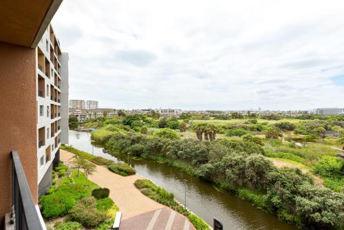 a view of a river from a building at Waters Edge Apartments in Cape Town