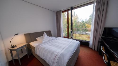 Ένα ή περισσότερα κρεβάτια σε δωμάτιο στο Wissenschaftszentrum Bonn