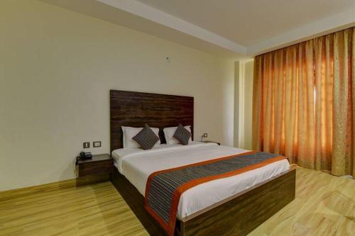 Ένα ή περισσότερα κρεβάτια σε δωμάτιο στο Country Inn Vrindavan