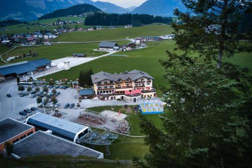 an aerial view of a town with a large building at Gasthaus-Landhotel Traunstein in Abtenau