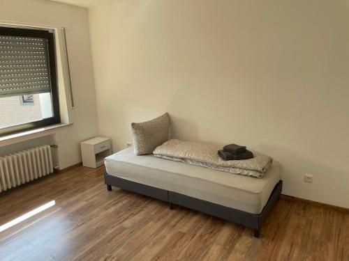 Ένα ή περισσότερα κρεβάτια σε δωμάτιο στο Apartment am Veener Kirchturm