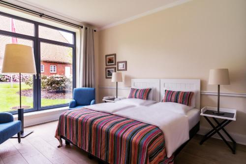 מיטה או מיטות בחדר ב-Hotel & Gästehaus Gut Kaden