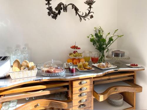 a table with a bunch of food on it at Villa Lina in Tremezzo