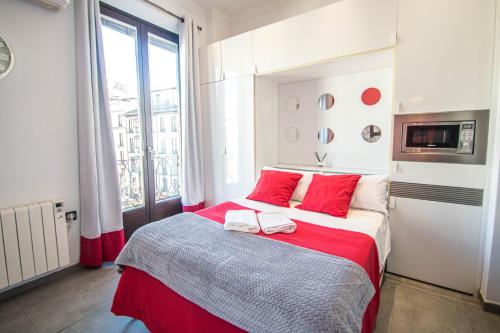 Cama o camas de una habitación en Plaza Nueva Apartment Granada by A3Rentals