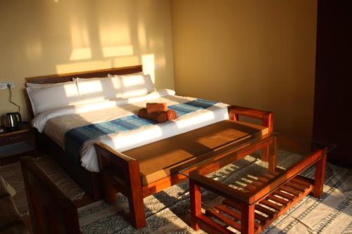 a bedroom with a bed with a teddy bear on it at Agonda Wellness in Agonda