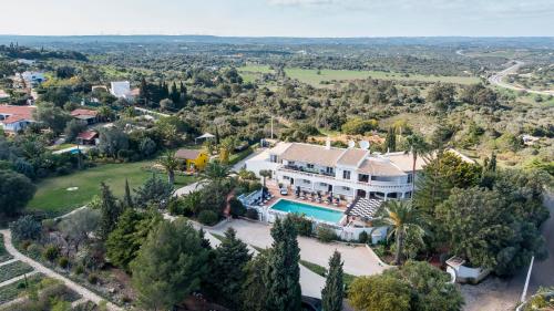 an aerial view of a house with a swimming pool at Casa Monte Cristo Apartments - Almond in Lagos