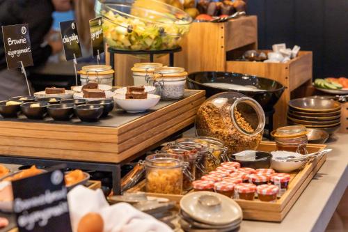 a buffet with various food items on a table at Boutique Hotel Beekhuizen in Velp