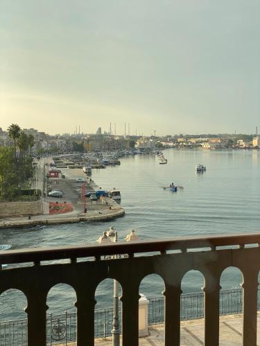 a view of a body of water with boats in it at Hotel Europa in Taranto