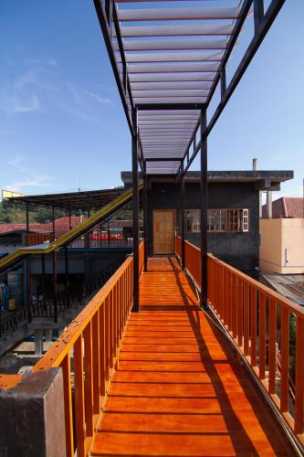 a wooden walkway with awning on top of a building at My Place Mae Salong in Ban A Ku