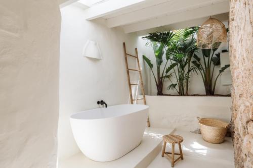 a bathroom with a white sink and a mirror at Agroturismo Can Domo in Santa Eularia des Riu
