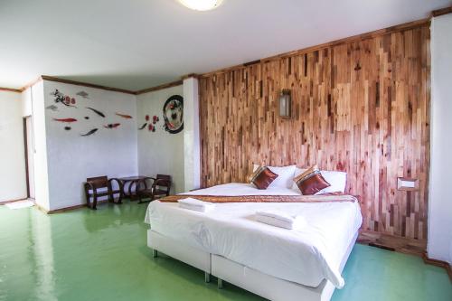 Postel nebo postele na pokoji v ubytování My Place Mae Salong