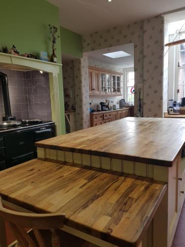 a kitchen with a wooden counter top in a room at Clift Hill in Carlisle