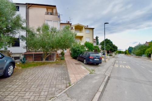 a car parked on the side of a street at Lovely apartment few minutes from the beach in Štinjan