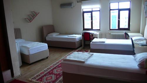 A bed or beds in a room at Trabzon Star Pension