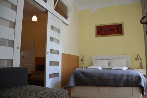 Ένα ή περισσότερα κρεβάτια σε δωμάτιο στο Residence B&B La Fontaine Aparthotel