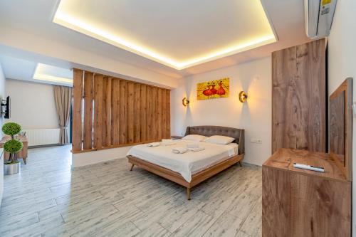 a bedroom with a bed in a room at Nakas Suites in Fethiye