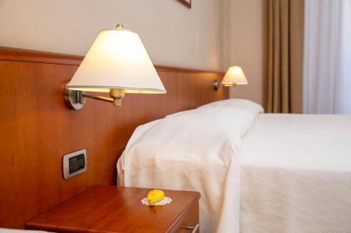 Letto o letti in una camera di Hotel Pietra di Luna