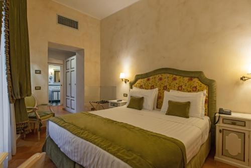a bedroom with a large bed in a room at Donna Camilla Savelli - VRetreats in Rome