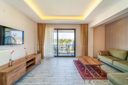 a living room with a couch and a table at Nakas Suites in Fethiye
