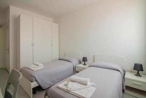 Ліжко або ліжка в номері Casa Lucia Valentini Terrani
