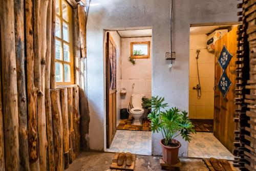 a bathroom with a toilet and a sink at Indi house in Sapa