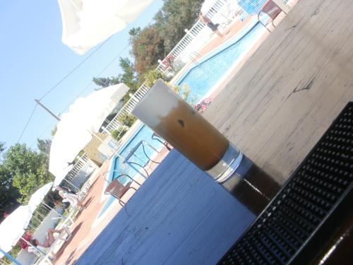 a metal object sticking out of a swimming pool at Galaxy Hotel in Argostoli