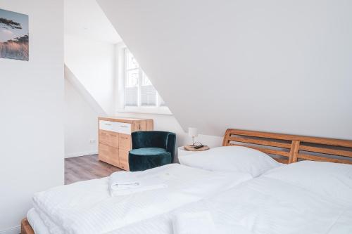 מיטה או מיטות בחדר ב-Westwind - Haus 1