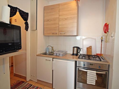 a small kitchen with a stove and a sink at Apartment Prater by Interhome in Budapest