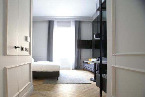 a bedroom with a bed and a window at Fingerprint Luxury Apartments 2 in Zagreb