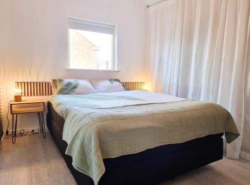 Posteľ alebo postele v izbe v ubytovaní Vakantiehuis Zuidkust Vlissingen VL19
