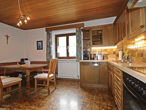 a kitchen with a table and a dining room at Apartment Mühlbach by Interhome in Vergotschen