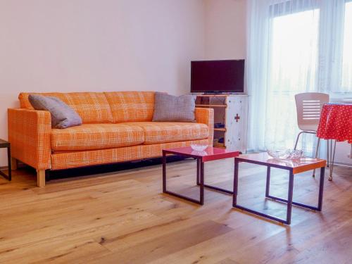 a living room with a couch and two tables at Apartment Viscaria-2 by Interhome in Zermatt