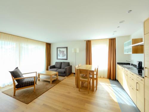 a kitchen and living room with a table and chairs at Apartment Zur Matte B-2 by Interhome in Zermatt