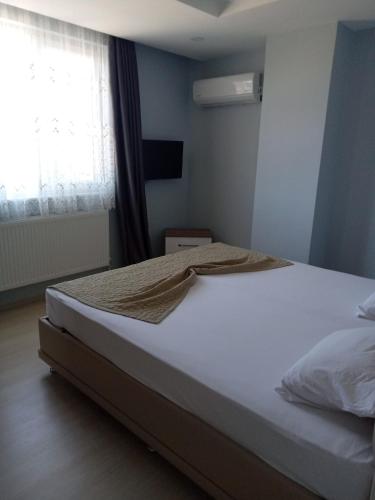 Katil atau katil-katil dalam bilik di Hannapart Otel