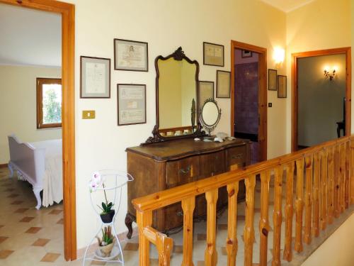 a room with a staircase and a mirror on the wall at Apartment Amalasunta by Interhome in Marta