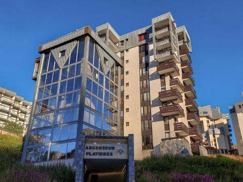 a tall building with a sign in front of it at Apartment Les Grandes Platières-12 by Interhome in Tignes