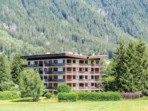 a large building in the middle of a mountain at Apartment Le Bois du Bouchet-1 by Interhome in Chamonix