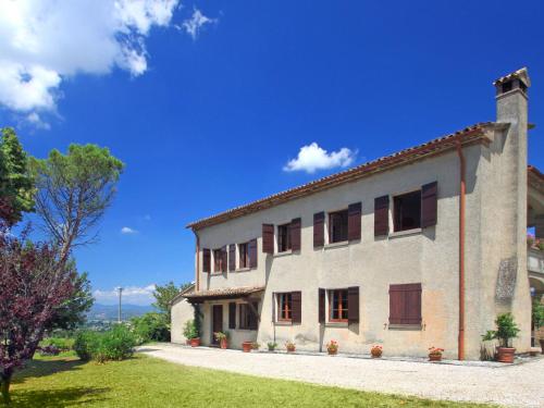 a large stone building with a blue sky in the background at Holiday Home Montebello by Interhome in Monterchi