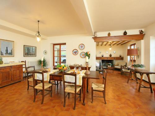 a large dining room with a table and chairs at Holiday Home Montebello by Interhome in Monterchi
